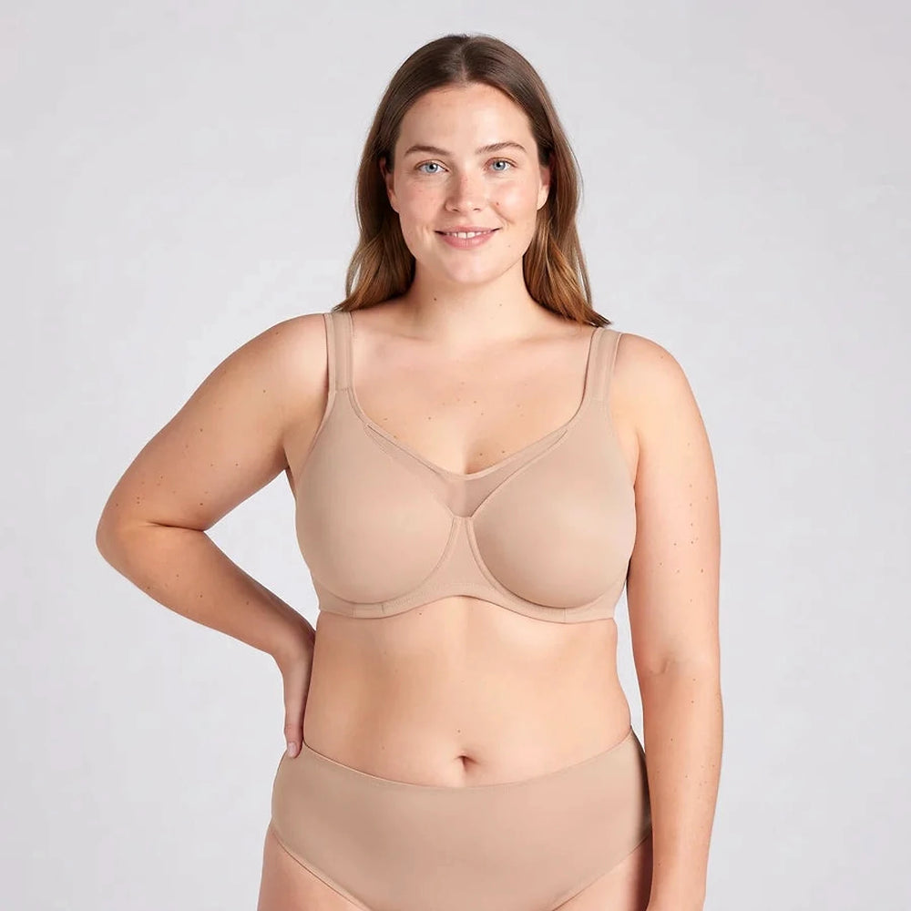 Lovelle Grace minimizer bra in beige with wide straps and a soft underwire, on a model