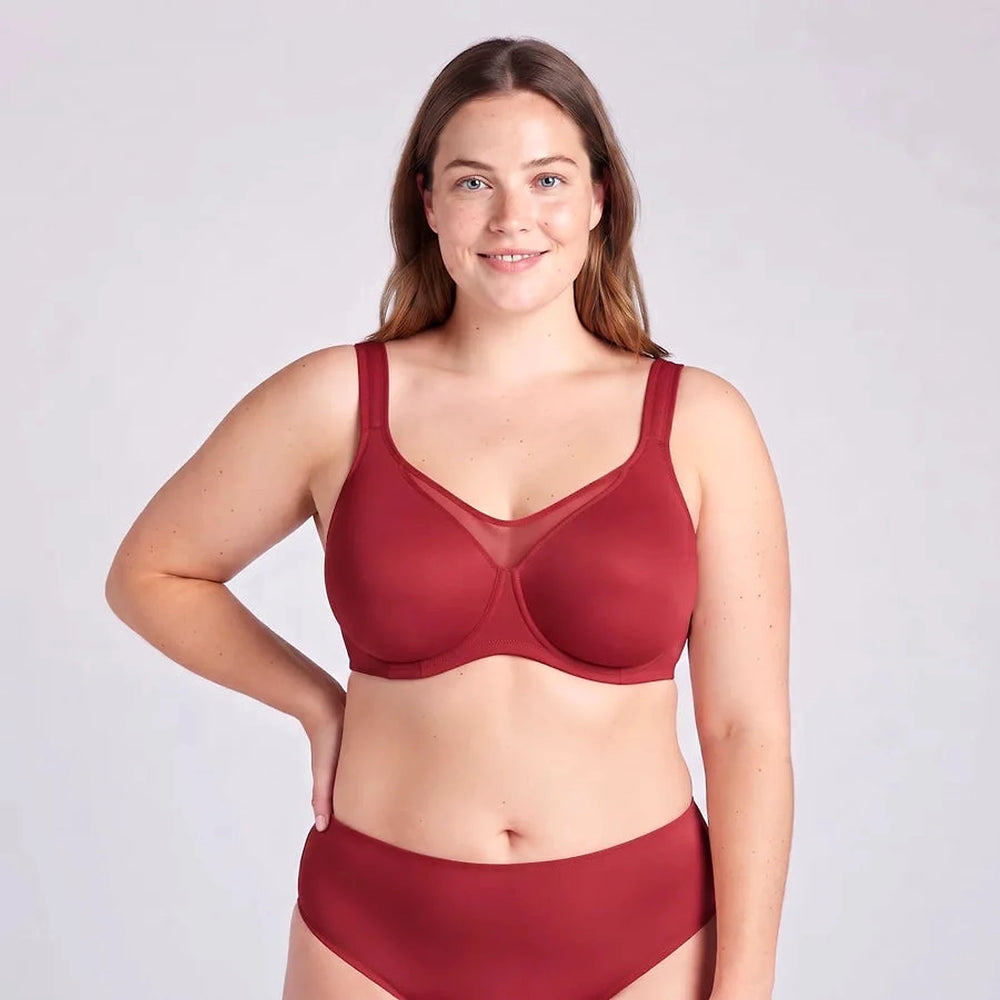 Lovelle Grace minimizer bra in wine red with a high centre panel, on a smiling model