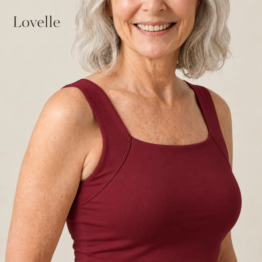 Smiling silver-haired woman wearing the Lovelle Ease built-in bra tank in wine red, square neckline and wide straps